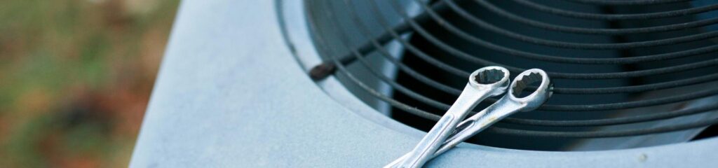 Commonly Asked Questions 6 a pair of scissors sitting on top of a metal object.