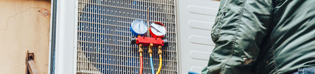 Commonly Asked Questions 4 a man standing next to a wall with a bunch of gauges attached to it.